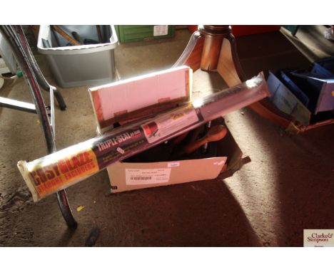 A box of vintage tools and two draft excluders