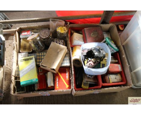 Two boxes containing screws, nails, chainsaw blade, brushes, varnishes, sandpaper etc.