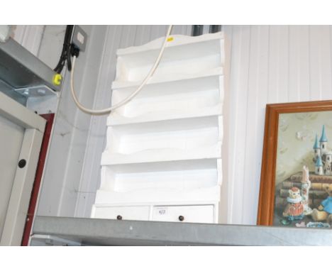 A white painted wall shelf, fitted two drawers