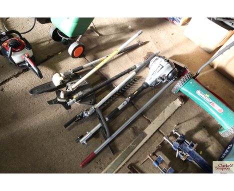 A Titan petrol multi tool comprising a hedge trimmer/strimmer and chainsaw attachments together with a lawn edge trimmer