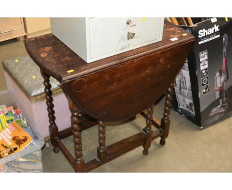 An oak barley twist gate leg table