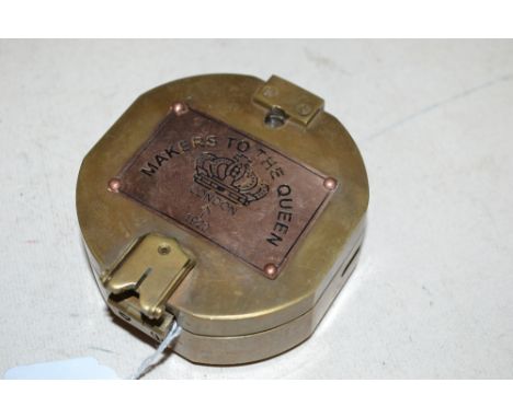 A reproduction brass compass (71)