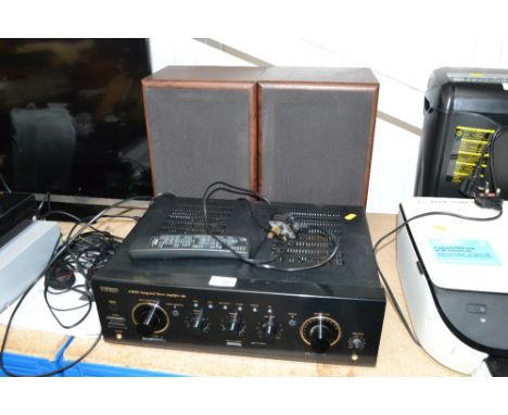 A Teac AR600 integrated stereo amplifier with remote control and a pair of Technics SB C250 speakers