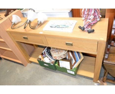 A modern light oak effect hall table fitted two drawers