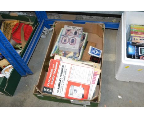 A box containing Home Maker Practical Householder and other magazines; a cribbage board; jigsaw puzzle etc