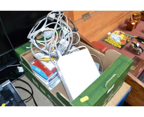 A Ninendo Wii console with accessories 