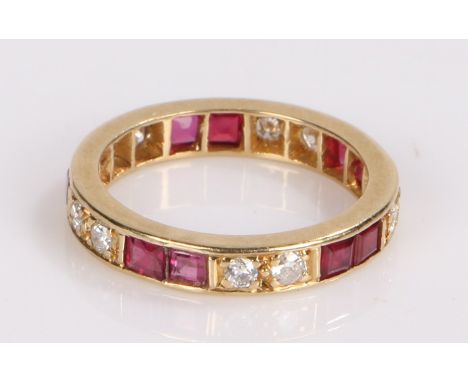 18 carat gold diamond and ruby set eternity ring, with interspersed pairs of rubies and diamonds, ring size G1/2