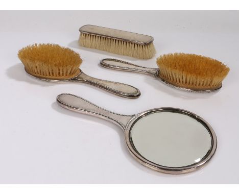 George V silver dressing table set, Birmingham 1922, maker Hasset &amp; Harper Ltd, comprising circular bevelled hand mirror,