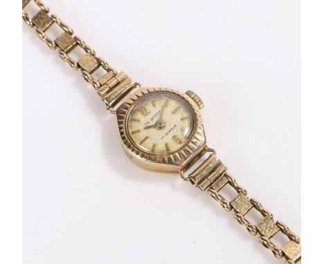 Regency 9 carat gold ladies wristwatch, with a signed dial and baton hours, manual wound, 9 carat gold strap, the case 15mm d