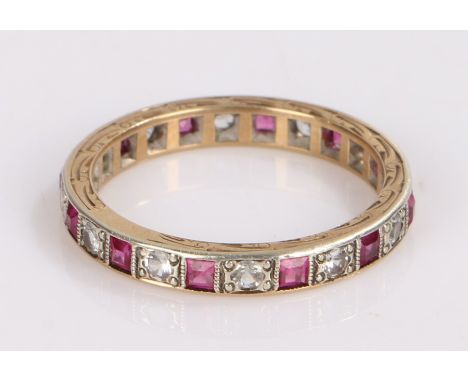 Ruby and cubic zirconia set eternity ring, with round cut cubic zirconia and square cut rubies, ring size Q1/2