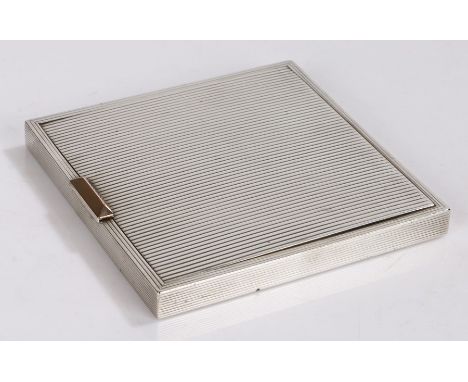 Silver compact, London mark only to interior, the reeded body with gilt catch, the interior with mirror and engine turned lid