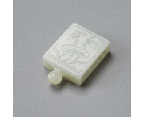 An excellent example of 18th century jade carving. This belt slide or fitting was designed to hold one of the many tools and 
