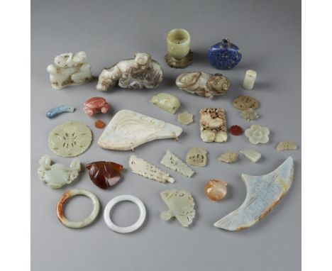 Lot of chinese jade carvings from a wide range of qualities and styles including several buttons and a snuff bottle Dimension