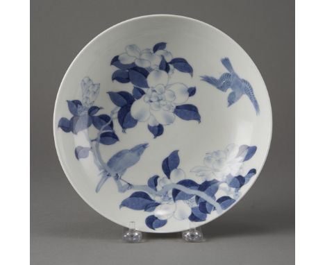 Nabeshima style Hirado porcelain dish decorated in under glazed blue, with flowers and birds on a branch and a tooth comb des