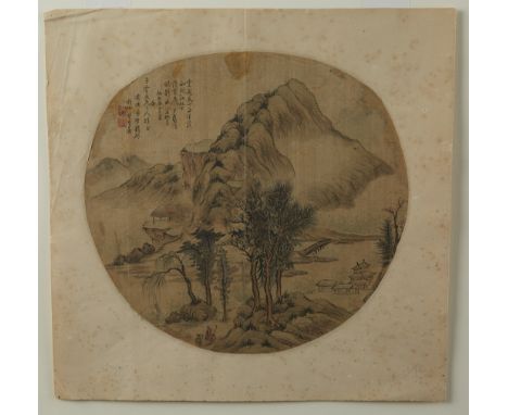 Wonderful ink and color fan painting on silk depicting a lovely mountainscape with a cluster of homes along the lower right. 