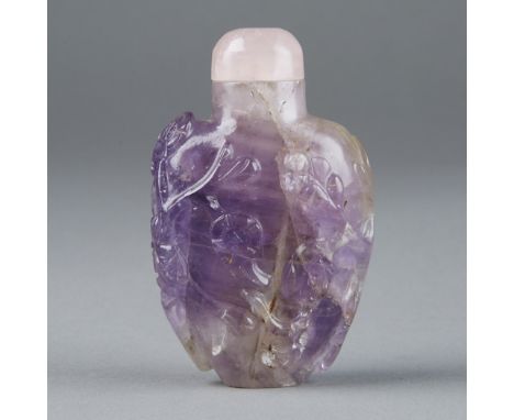 A fantastic Chinese Snuff Bottle decorated with beautiful flowing tendrils in subtle relief carving.  Retains original lid. F