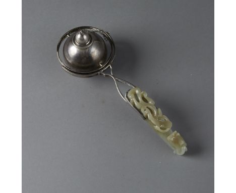 This fine early Chinese jade belt hook is well carved and an excellent example of its kind. The oil reservoir is mounted in a