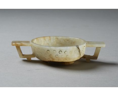 An exceptional Chinese double handled cup carved from a beautiful pale jade with inclusions. Likely 17th century. Lovely hand