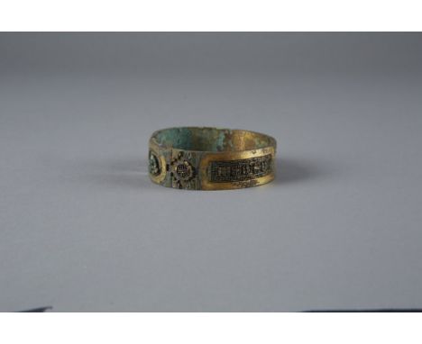There are several beautiful designs and characters cast into the bangle which mirror one another on either side of the centra
