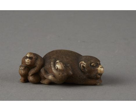 An incredible stag antler netsuke carving of a monkey and children. Excellent carving rendering each detail in fantastic qual