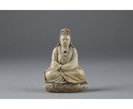 A stunning example of early Chinese soapstone carving.  This Guanyin is a fantastic example of its kind. Delicately carved ro