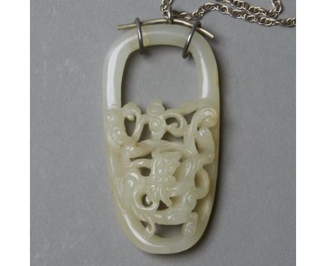 A very fine piece of early Qing jade buckle mounted into a necklace.  The carving and quality of the jade are excellent. The 