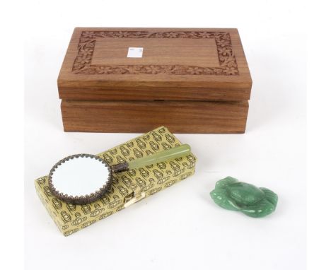 A jade carving of a crab, a Chinese hand mirror with porcelain back and jade handle and a hardwood trick box, 20.5cm wide