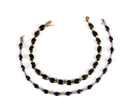 A sapphire and diamond line bracelet, the sixteen oval cut sapphires interspersed with diamond set links, to a 14K white gold