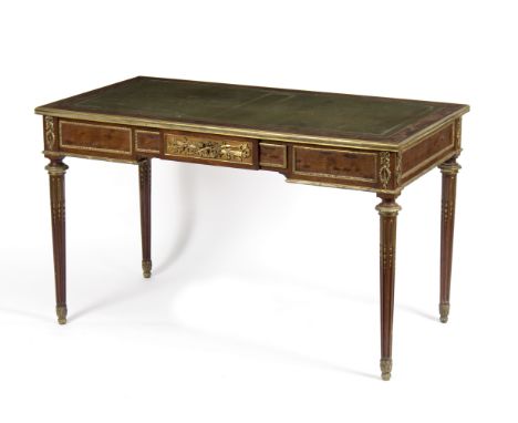 A Louis XVI style walnut and gilt metal mounted bureau plat by Victor Raulin, the top with inset green leather writing surfac