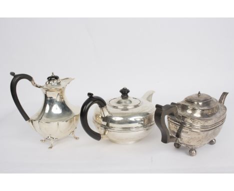 A circular silver teapot, WN, Chester 1905, with presentation inscription and ebonised handle, a rectangular silver teapot an
