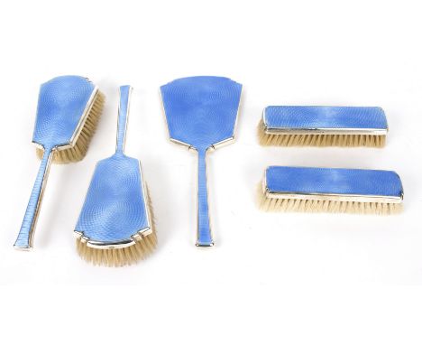 A silver mounted dressing table set, W N Ltd., Birmingham 1930, with blue guillouché enamel backs Condition Report: Overall t