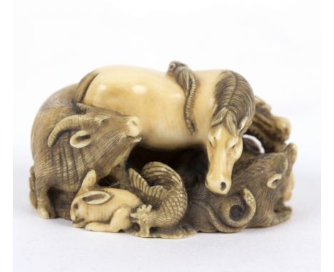 A Japanese ivory netsuke, carved zodiac of Animals, signed Meigyo Kusai, 2.5cm high Condition Report: This lot contains an el