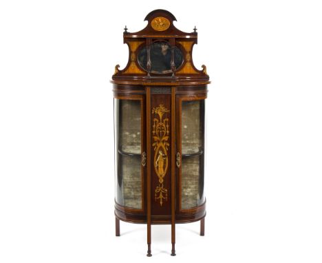 An Edwardian inlaid display cabinet with superstructure over and rounded doors to the sides, on square legs, 61cm wide Condit