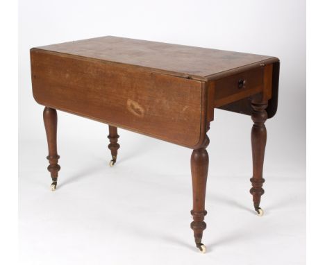 An early mahogany Pembroke table, on baluster turned legs with ceramic castors, 105cm wide