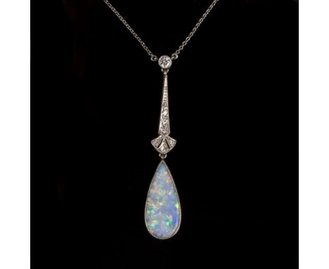 An Art Deco opal and diamond pendant, the drop setting with graduating millegrain set diamonds suspending a pear shaped opal 