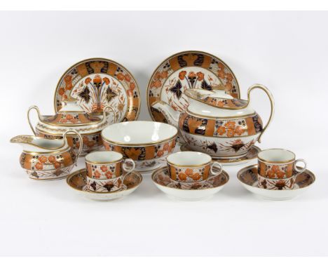 A New Hall tea set, circa 1810, pattern 893, decorated in the Imari palette, comprising teapot, cover and stand, sugar basin 