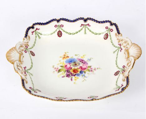 A Royal Worcester shell-handled dish, date code for 1913, decorated by E Phillips with central bouquet of flowers and border 