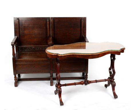 A Victorian burr walnut side table, the shaped top on carved supports terminating on sabre legs, 108cm wide, together with a 