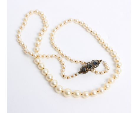 A single row cultured pearl necklace the graduated pearls to a diamond and sapphire set clasp, gross weight approximately 20.