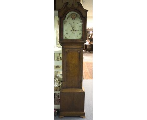 A 19th Century eight-day oak longcase clock, the painted dial with aperture and subsidiary dial, the hood with broken swan ne