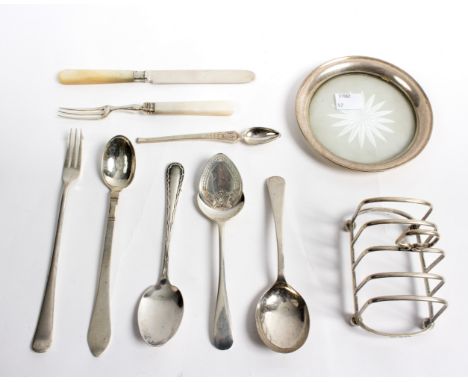 A silver toast rack, JBC &amp; S, 1929, a sterling silver teapot stand, silver spoons, etc., gross weight approximately 360gm