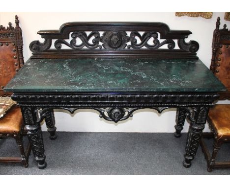 A late Victorian ebonised console table with pierced back, simulated green variegated marble top and pierced frieze, on squar