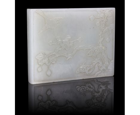 A pale celadon jade rectangular belt plaque, 19th Century, carved with a bird in prunus tree, 6.25cm wide Condition Report: A