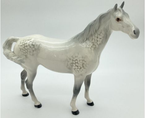 A Beswick ceramic Swish tail horse figure #1182, in grey gloss finish. First version with tail attached to the quarter higher