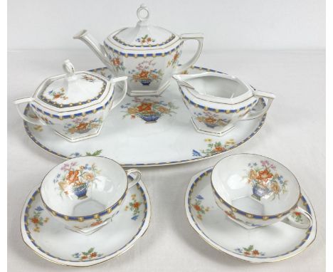 An early 20th century MZ Altrohlau CM-R, Czechoslovakia, ceramic tea for two set. With floral pattern and pale blue and yello