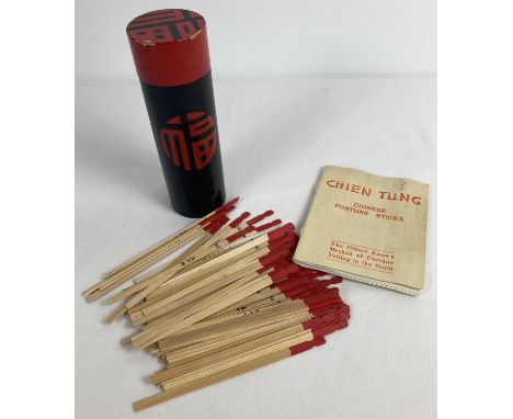 A vintage bamboo set of Chinese fortune sticks 'Chien tung'. In black and red painted box, with instruction booklet. 