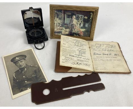 A small collection of WWII era army memorabilia. A bakelite cased folding magnetic marching compass (mark 1) by T.G.Co Ltd, a
