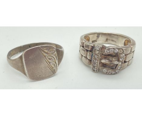 2 men's vintage silver rings. A clear stone set buckle ring, marked 925 to inner band (ring size R), together with a square s