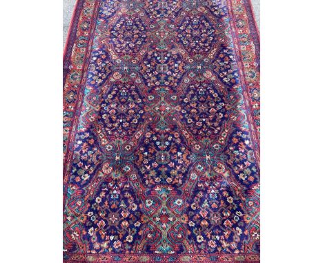 A vintage Belgian dining table cover/protector. Red ground with deep blue, green and brown colours. Approx. 260cm x 140cm (wi