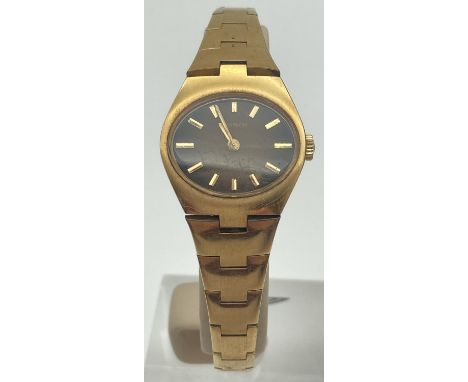 A ladies vintage gold plated bracelet strap wristwatch by Tissot. Oval shaped bronze coloured face with gold tone hour marker